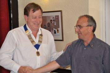 outgoing Lion President Twiggy Lake hands over chain of office to Lion Dr Alan Benson